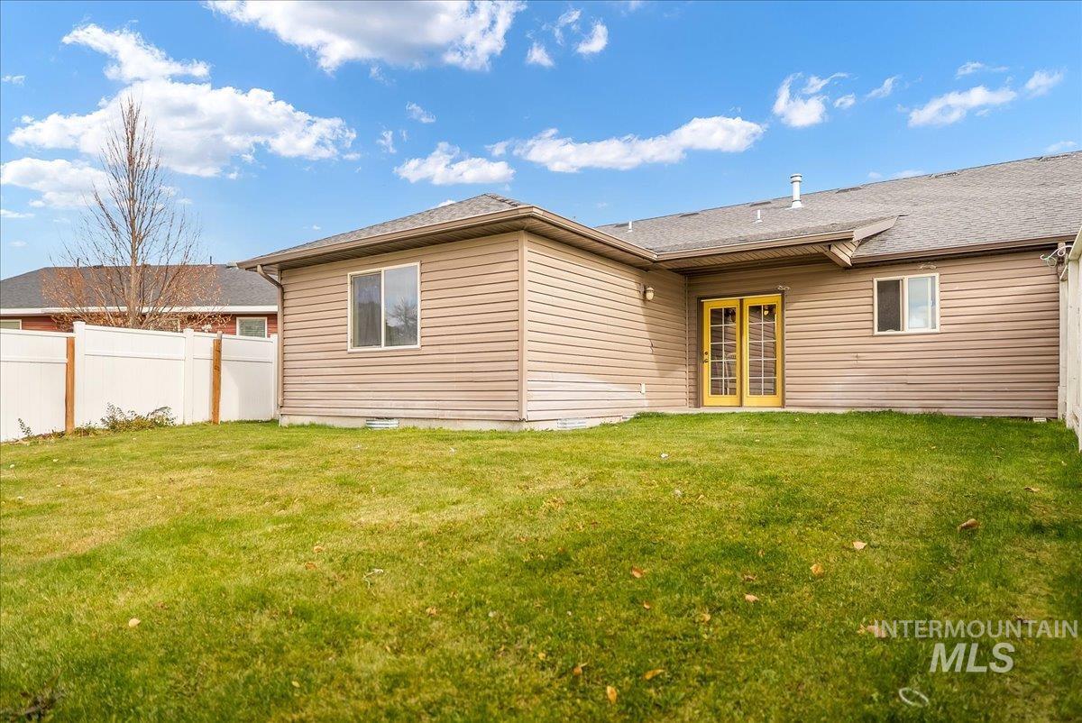 215 Little Cedar Street Hansen, ID 83334 - Photo 23 of 26 Back of property with a shingled roof, french doors, and a patio