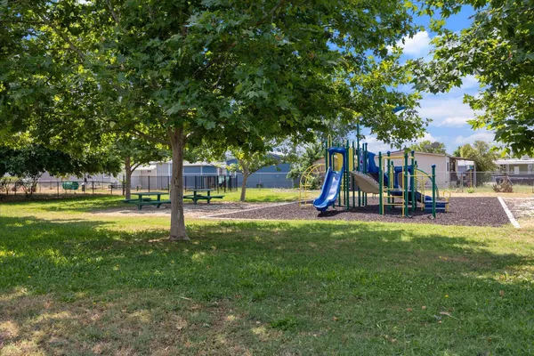 a view of a park with a slide