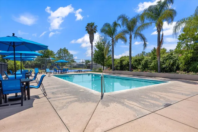 a view of a swimming pool with chairs