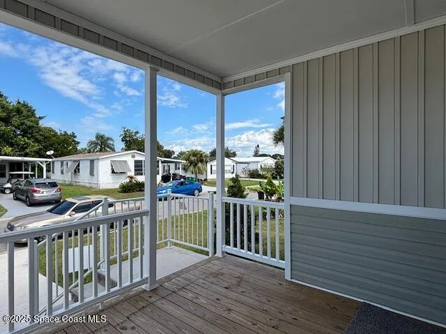 a view of a balcony with chairs