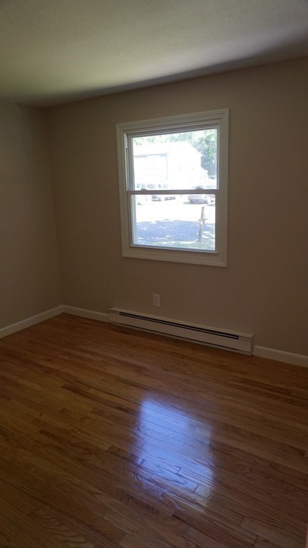 95 Sierra Vista Road Springfield, MA 01128 - Photo 15 of 28 a view of an empty room with wooden floor and a window