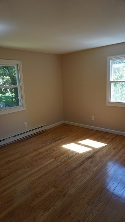 95 Sierra Vista Road Springfield, MA 01128 - Photo 16 of 28 a view of empty room with wooden floor and fan