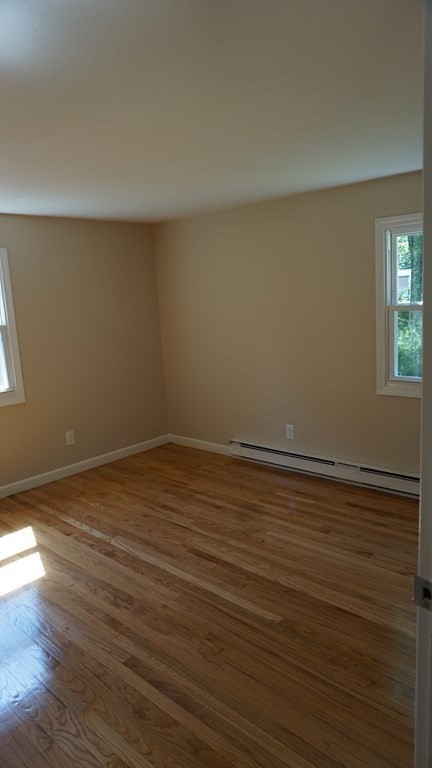 95 Sierra Vista Road Springfield, MA 01128 - Photo 17 of 28 a view of an empty room with wooden floor and a window