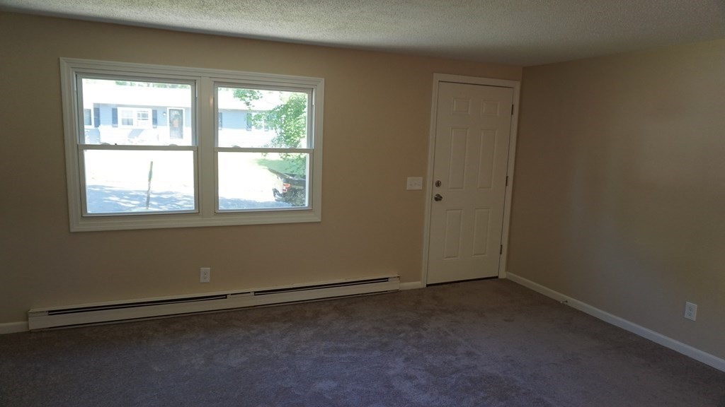 95 Sierra Vista Road Springfield, MA 01128 - Photo 2 of 28 an empty room with a empty space and windows