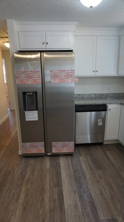 95 Sierra Vista Road Springfield, MA 01128 - Photo 6 of 28 a kitchen with granite countertop a refrigerator and a stove