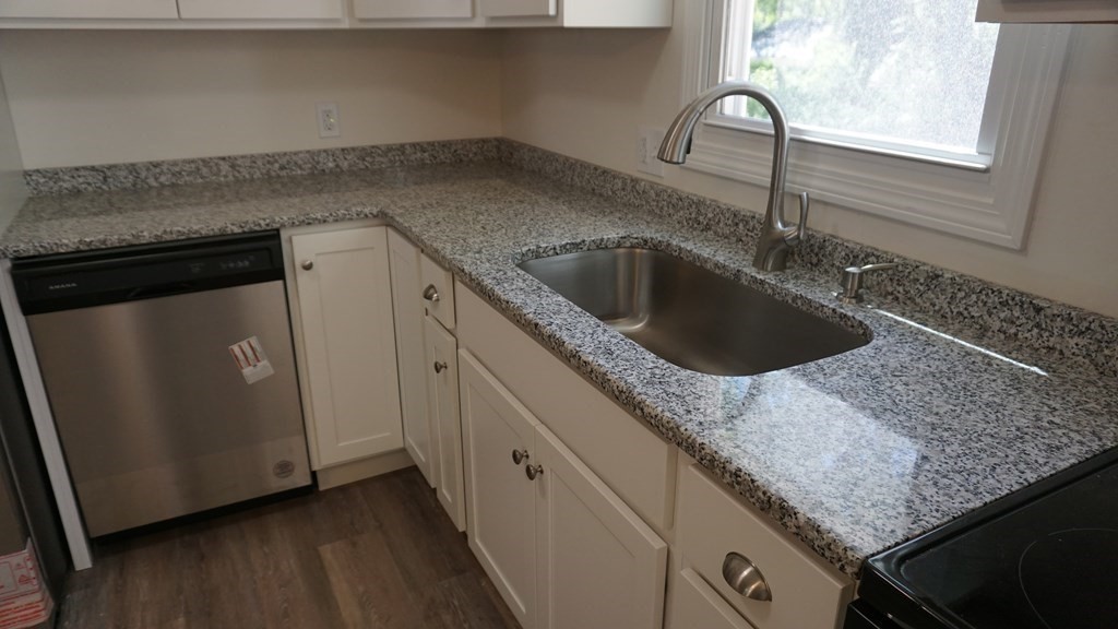 95 Sierra Vista Road Springfield, MA 01128 - Photo 7 of 28 a kitchen with granite countertop a sink and a wooden floor