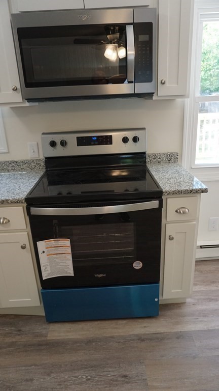 95 Sierra Vista Road Springfield, MA 01128 - Photo 8 of 28 a stove top oven sitting inside of a kitchen