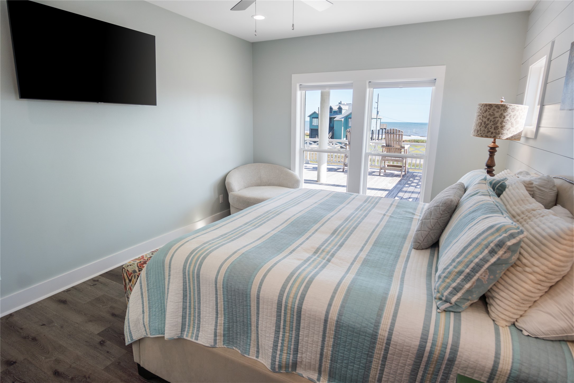 940 Raymond Port Bolivar, TX 77650 - Photo 26 of 46 a bedroom with a bed and a flat screen tv