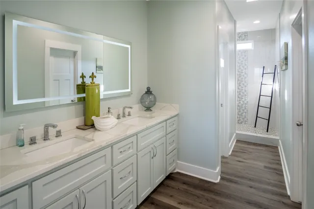 a bathroom with a shower and a sink