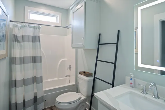 a bedroom with a bed and flat screen tv