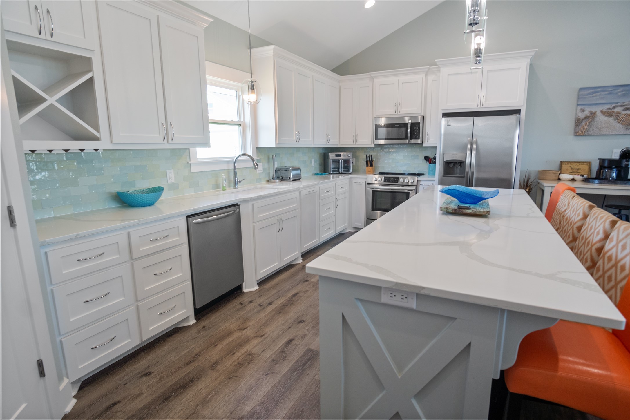 940 Raymond Port Bolivar, TX 77650 - Photo 9 of 46 a kitchen with granite countertop white cabinets and white appliances