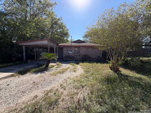 a view of a house with a yard covered with snow in front of house