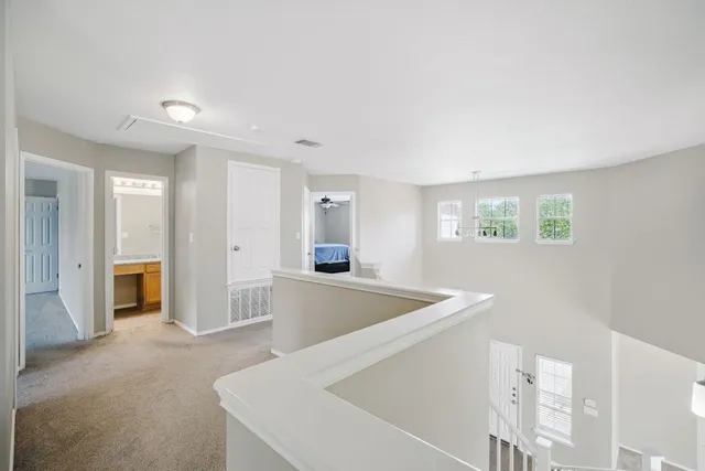 a view of a kitchen with a sink and a refrigerator