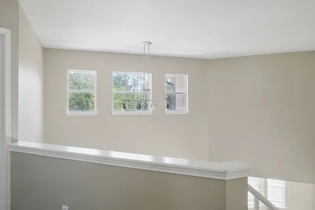 a view of room with window and ceiling fan
