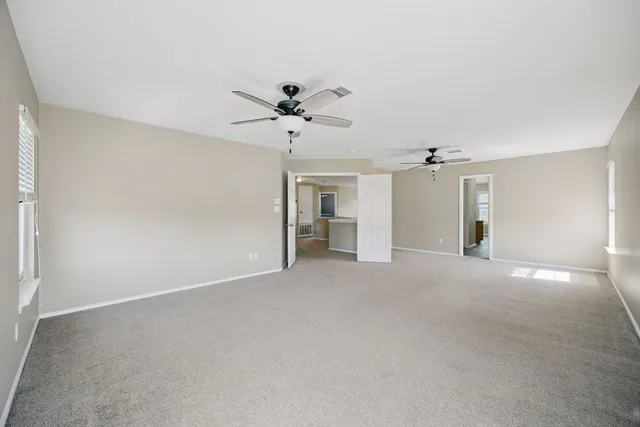 a view of a big room with carpet