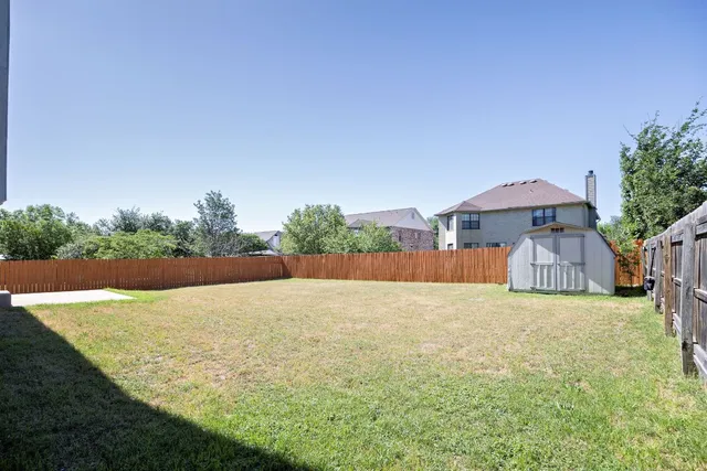 a view of a swimming pool and yard