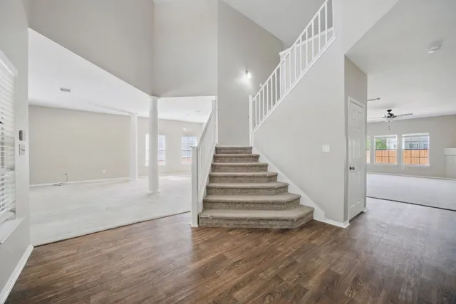 a view of an entryway with wooden floor
