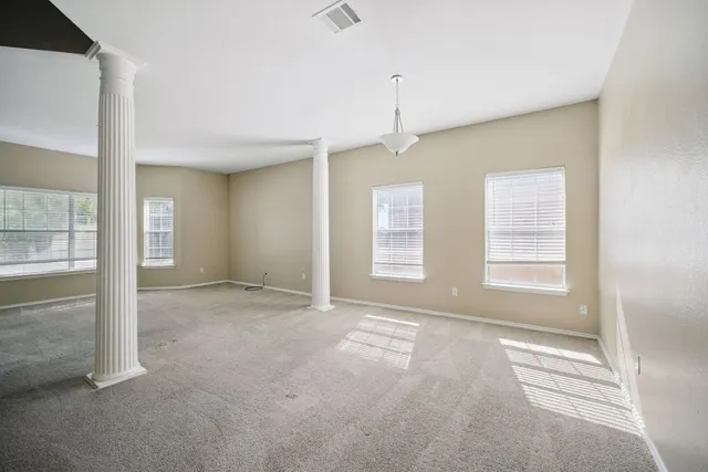 a view of an empty room with a window