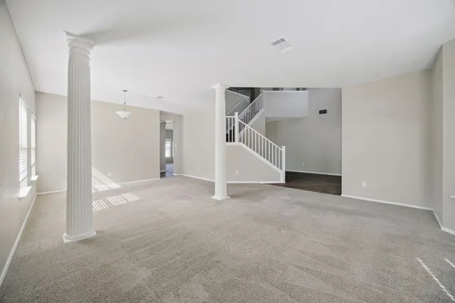 a view of an empty room with a fireplace