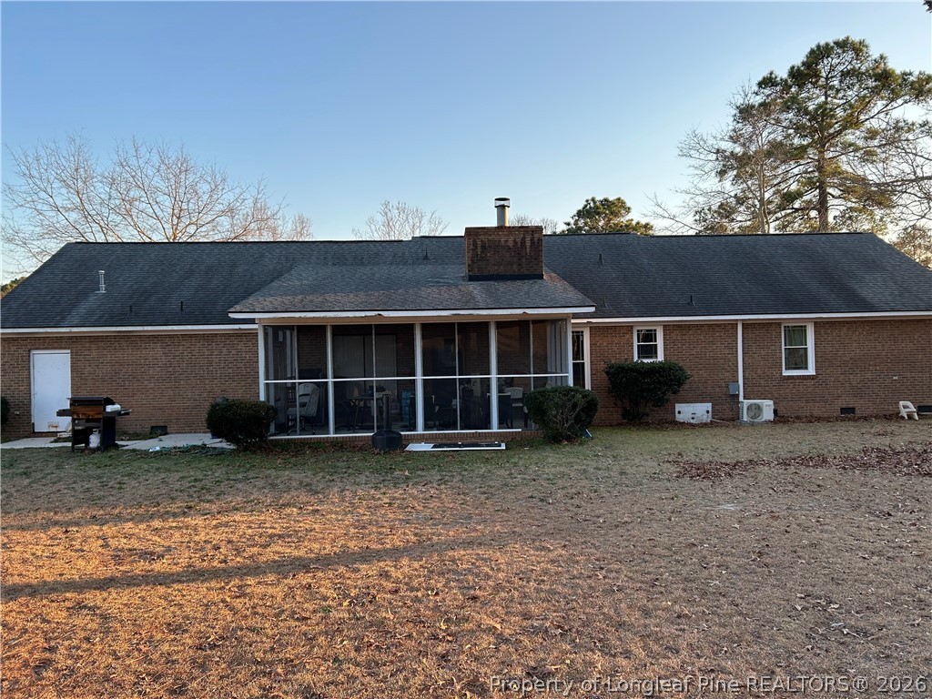6520 Bagdad Road Fayetteville, NC 28306 - Photo 6 of 6 a view of a house with a backyard and a window
