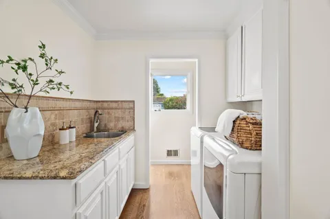 a kitchen with sink and washing machine