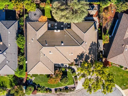 an aerial view of residential houses with outdoor space