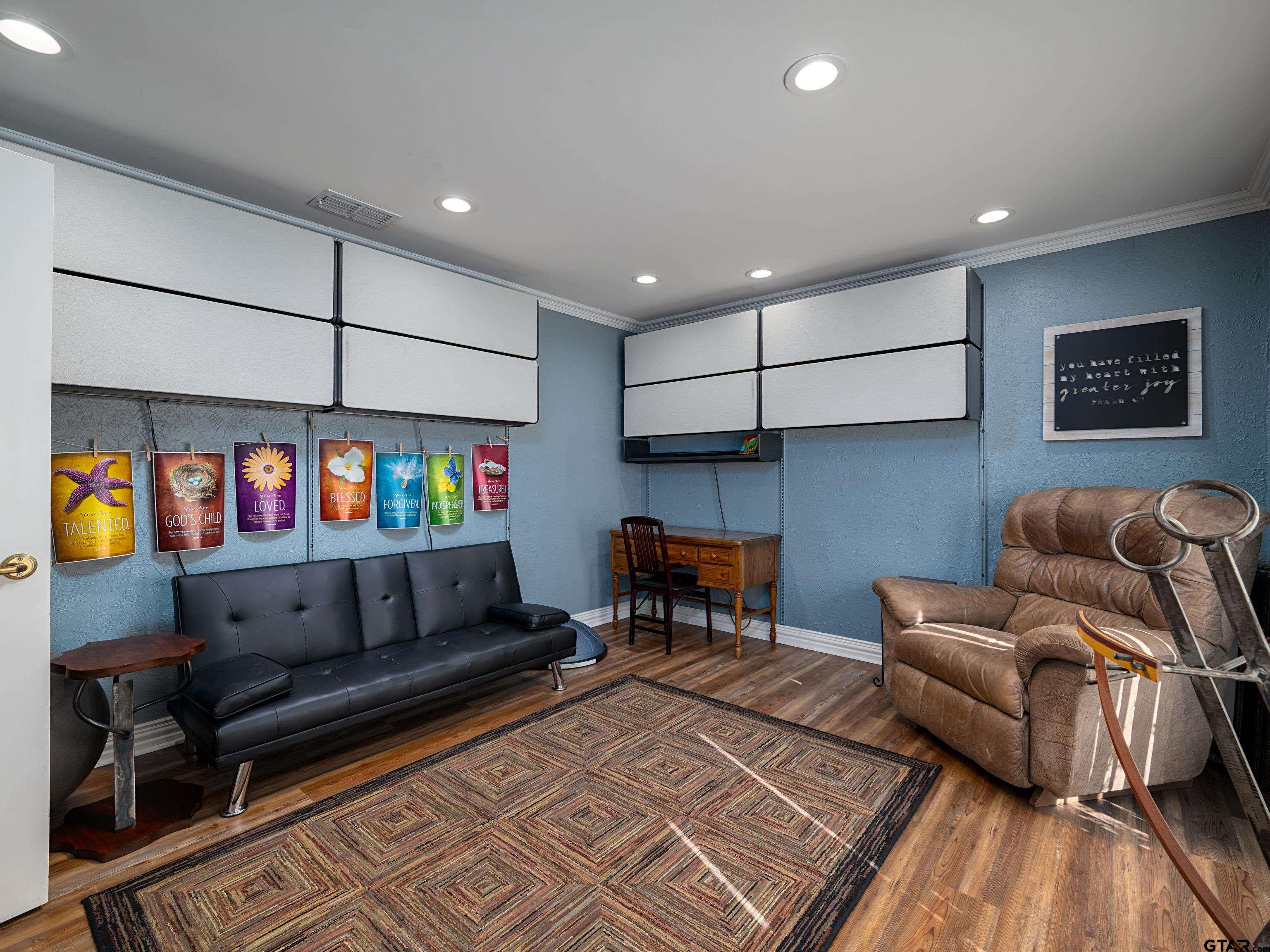 8212 Cambridge Road Tyler, TX 75703 - Photo 28 of 44 a living room with furniture and a flat screen tv