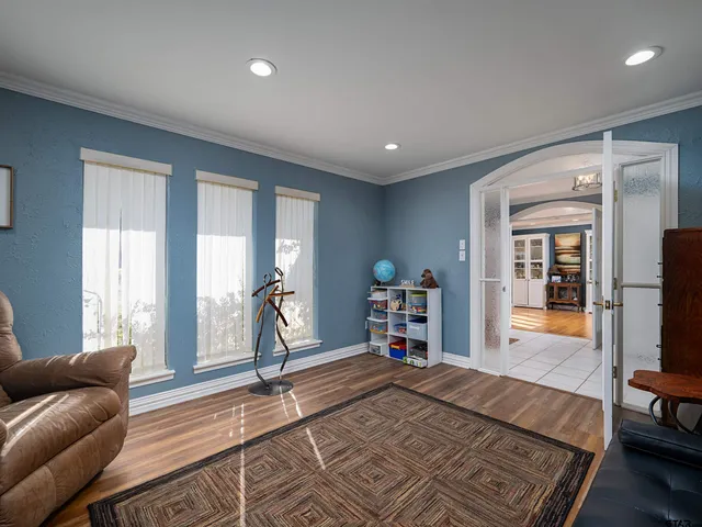 a bedroom with furniture and a window
