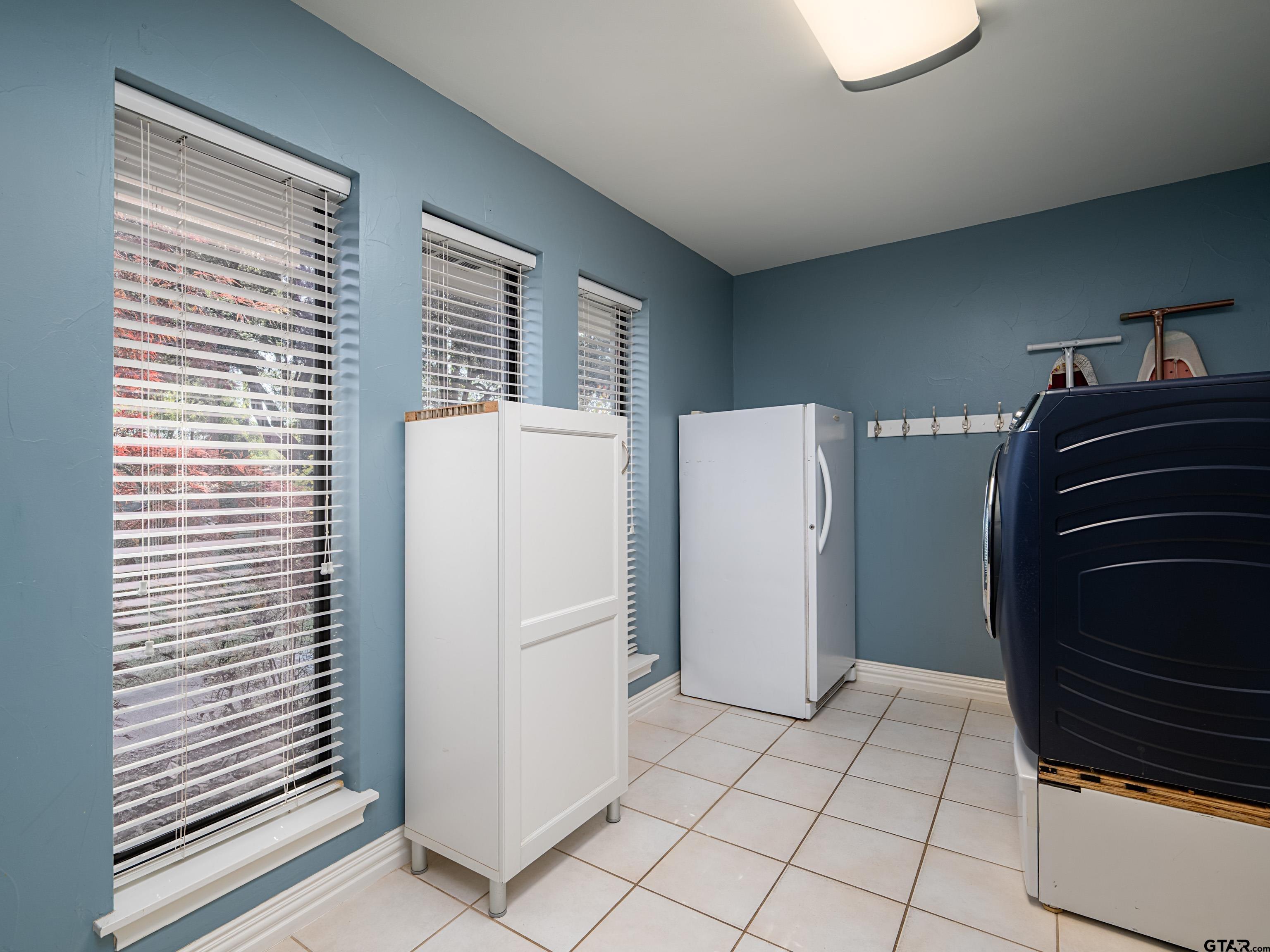 8212 Cambridge Road Tyler, TX 75703 - Photo 31 of 44 a view of kitchen and utility room