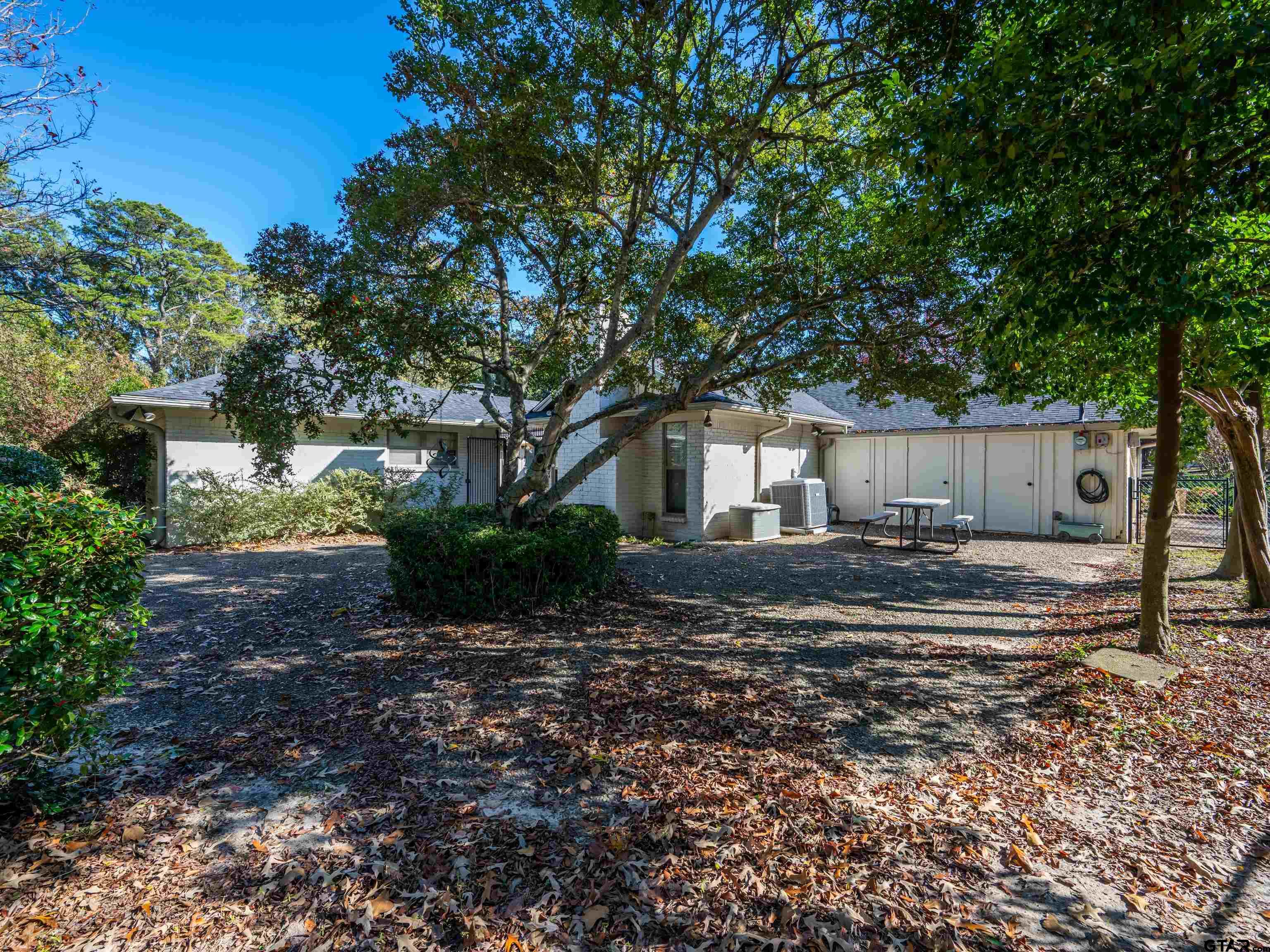 8212 Cambridge Road Tyler, TX 75703 - Photo 35 of 44 a front view of a house with garden