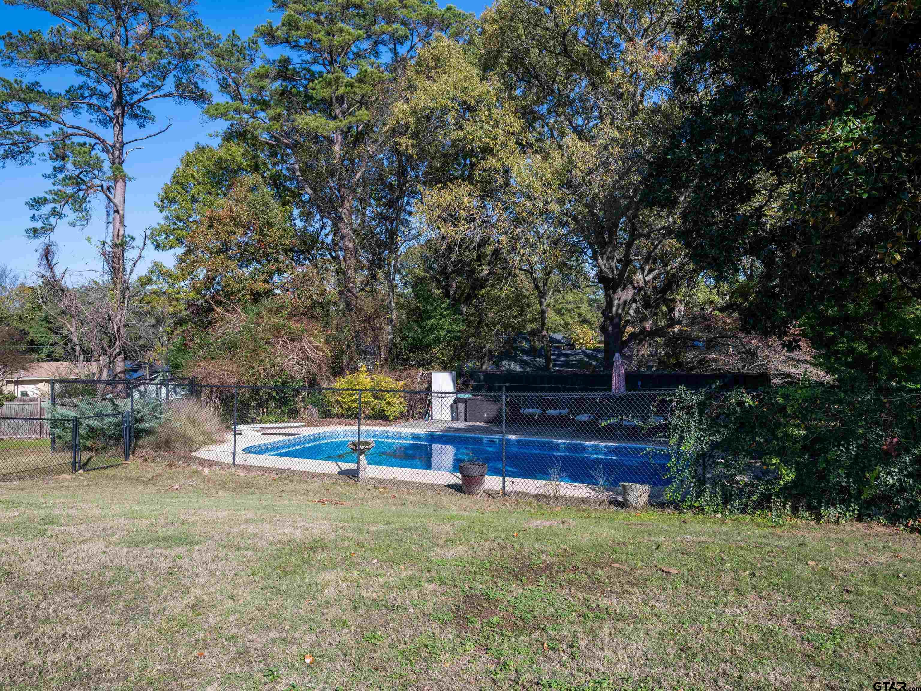 8212 Cambridge Road Tyler, TX 75703 - Photo 39 of 44 a view of a yard with a tree