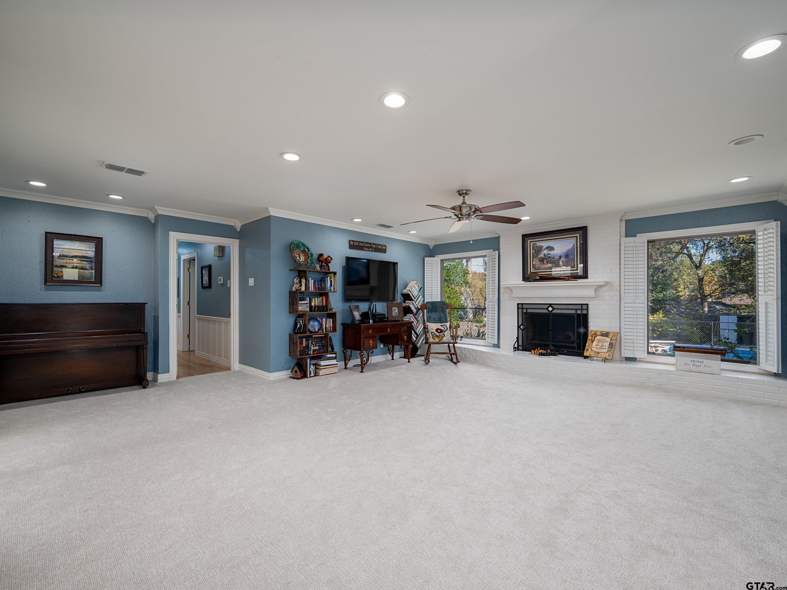 8212 Cambridge Road Tyler, TX 75703 - Photo 8 of 44 a view of a livingroom with furniture and a fireplace