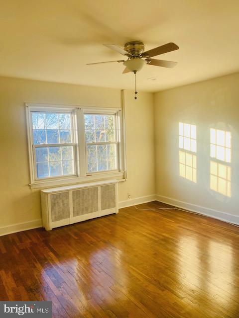 1649 Trinidad Avenue Northeast Washington, DC 20002 - Photo 18 of 18 a view of an empty room with a window and wooden floor