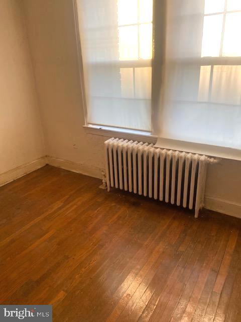 1649 Trinidad Avenue Northeast Washington, DC 20002 - Photo 5 of 18 a view of a room with wooden floor and a window