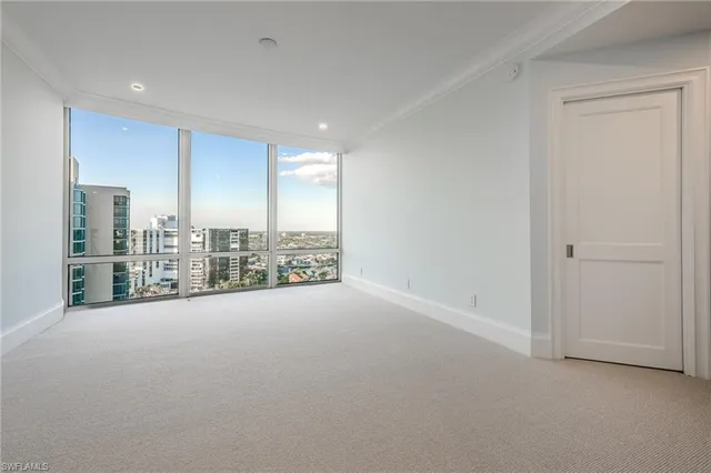 a view of a room with large windows