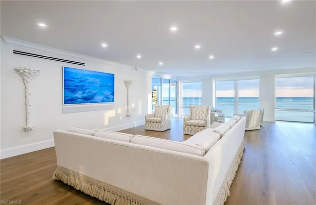 a dining room with furniture and wooden floor