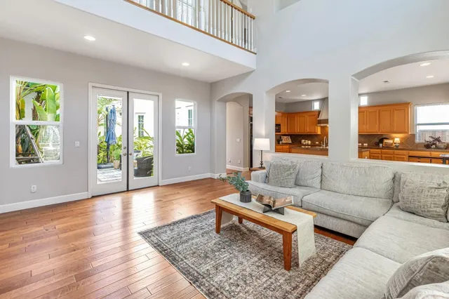 a view of a patio with chairs and potted plants