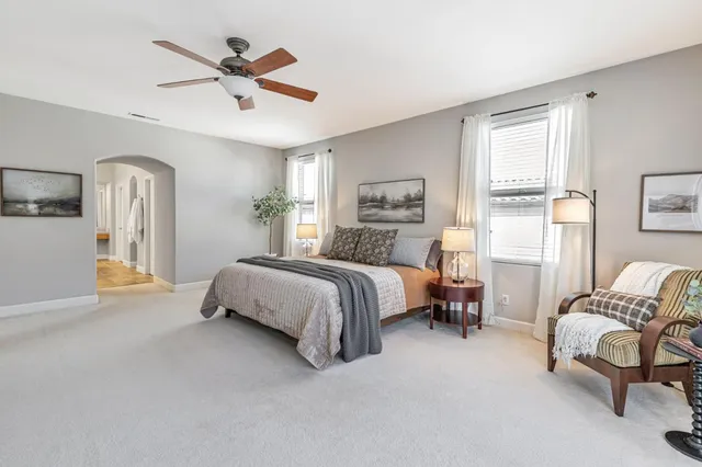 a bathroom with a tub a sink shower and mirror