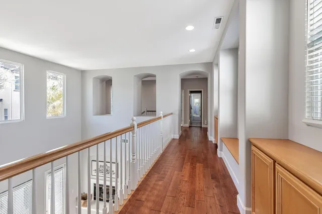 a bedroom with a bed and a potted plant