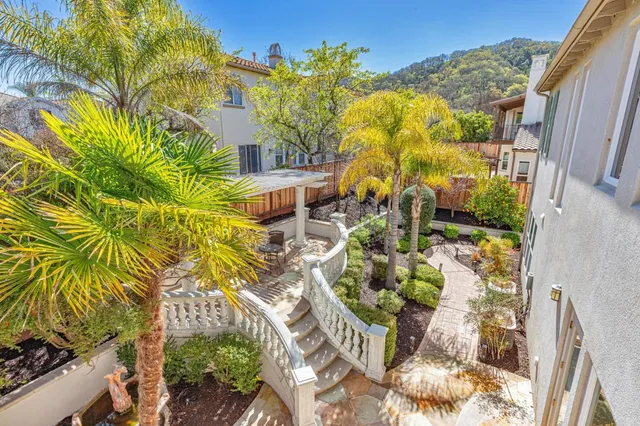 a front view of a house with a yard and a garage