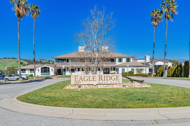 a view of a field with trees in the background