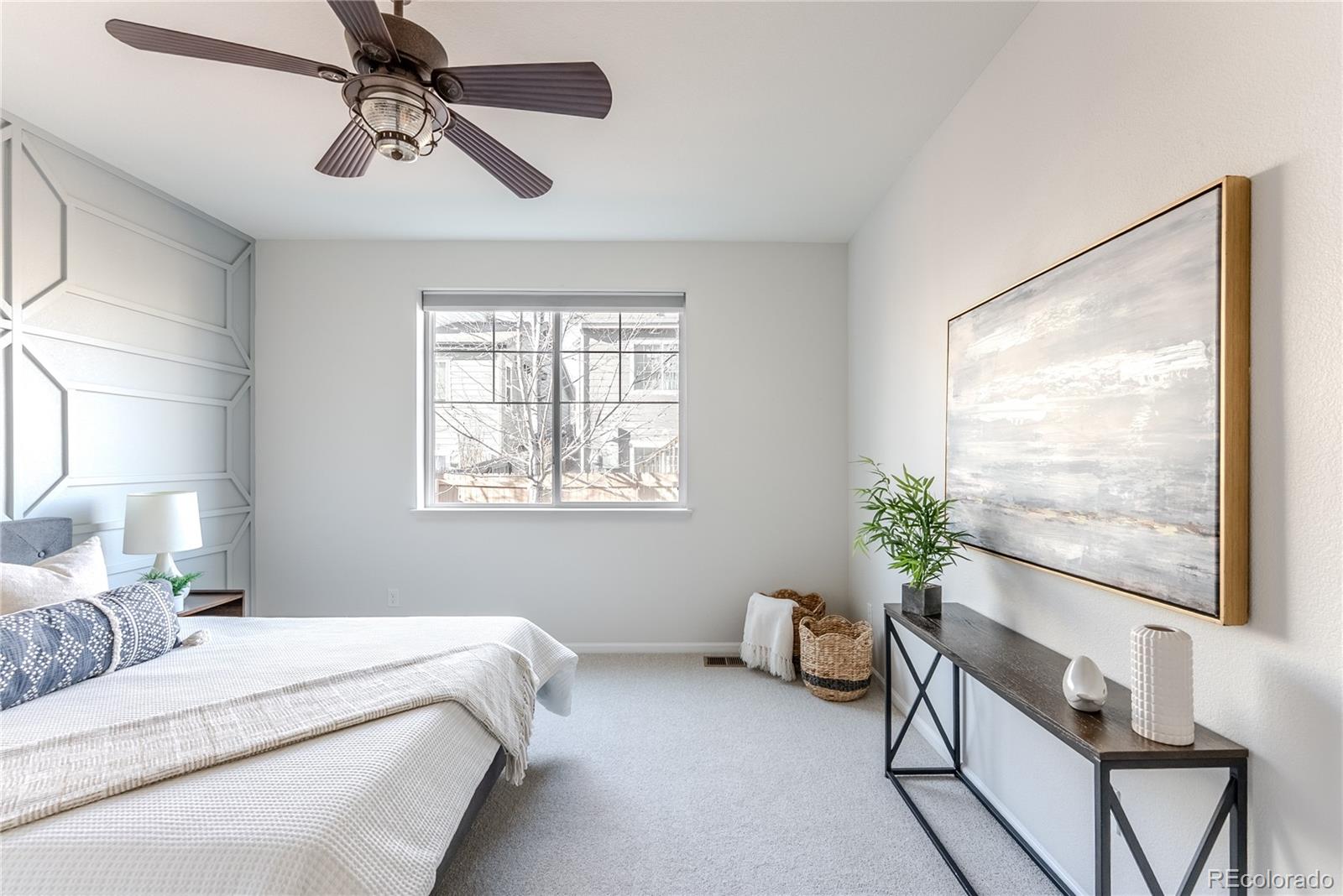 602 Mathews Way Erie, CO 80516 - Photo 17 of 50 a bedroom with furniture and a large window