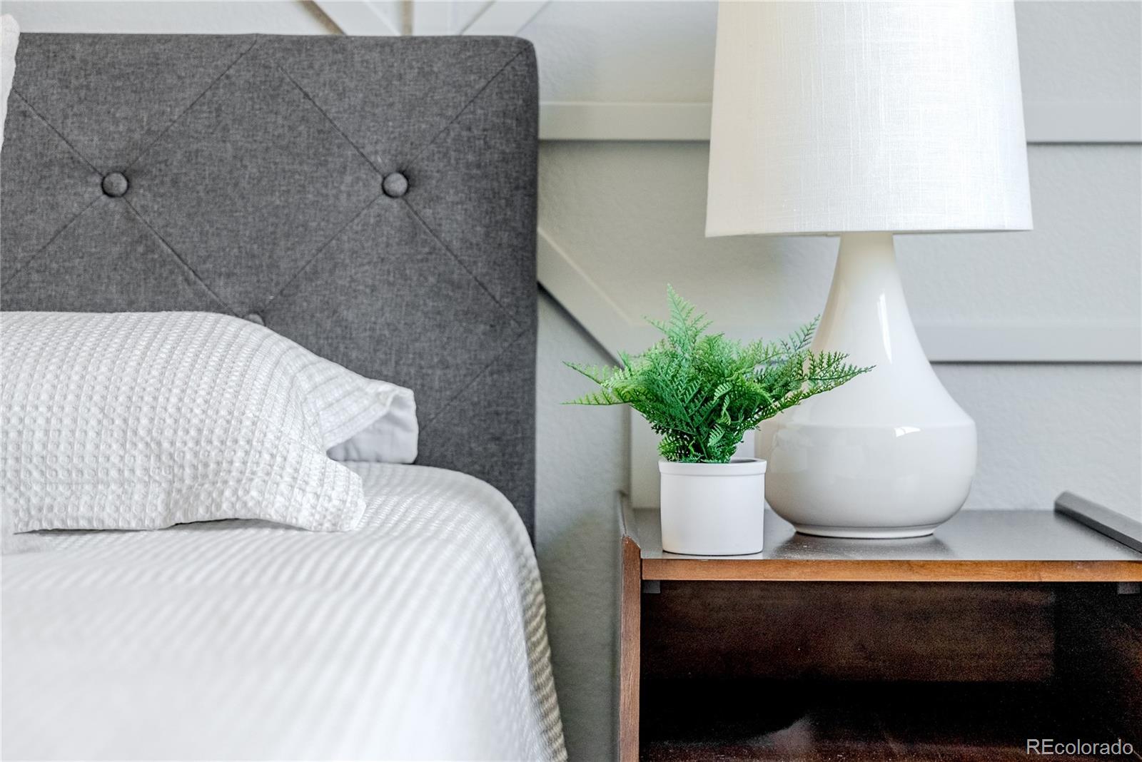 602 Mathews Way Erie, CO 80516 - Photo 19 of 50 a white vase with flowers sitting on a table