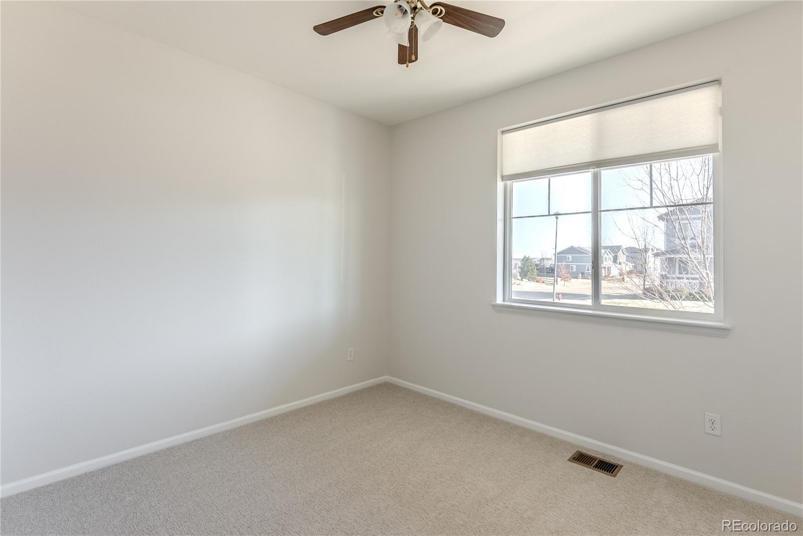602 Mathews Way Erie, CO 80516 - Photo 24 of 50 an empty room with a window