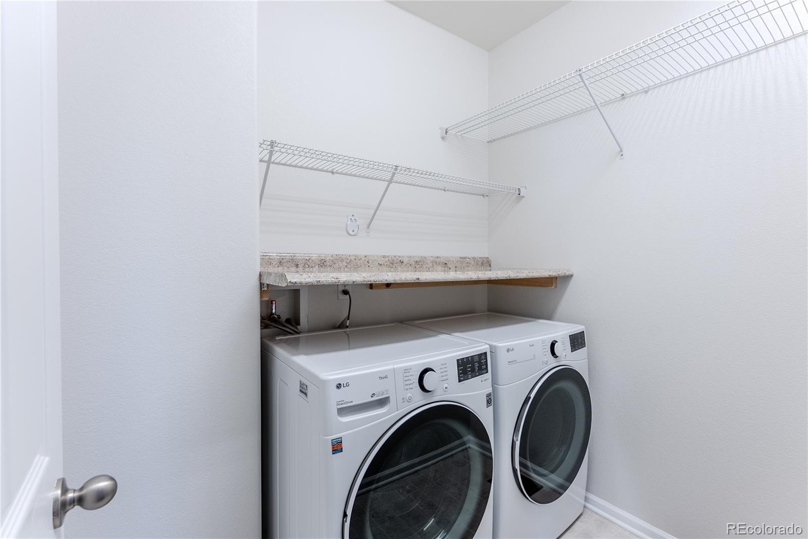 602 Mathews Way Erie, CO 80516 - Photo 27 of 50 a utility room with dryer and washer