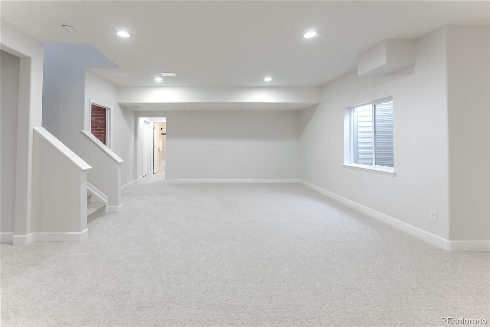 602 Mathews Way Erie, CO 80516 - Photo 31 of 50 an empty room with windows