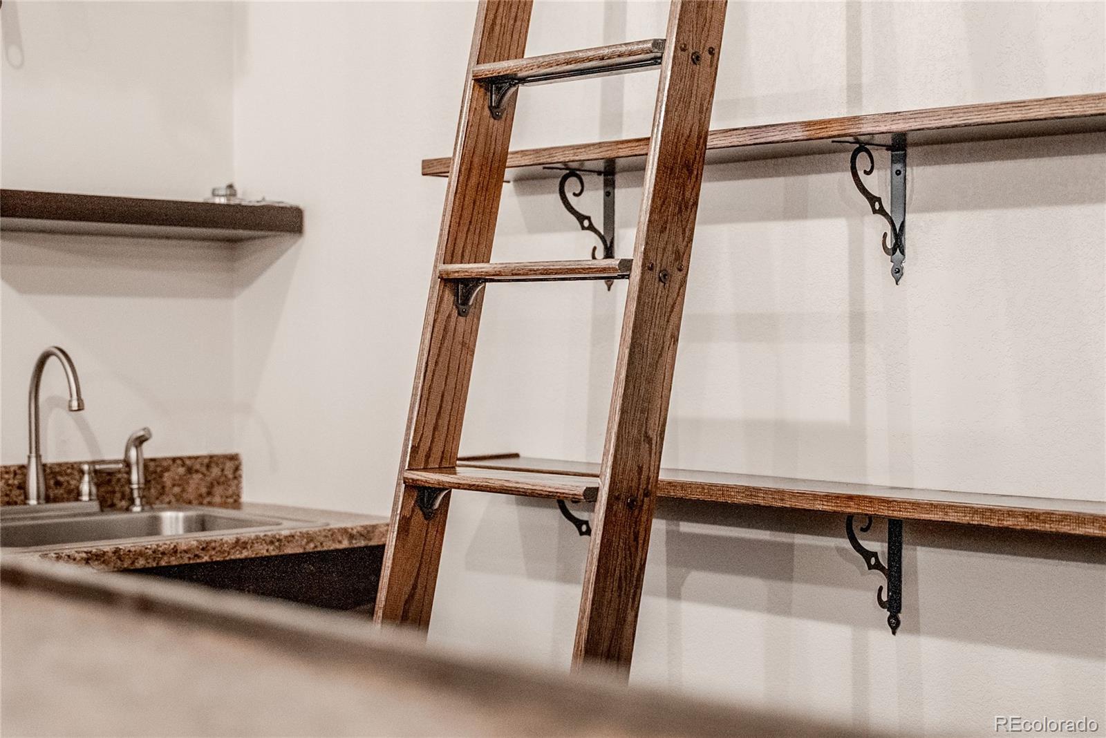 602 Mathews Way Erie, CO 80516 - Photo 33 of 50 a view of a room with rack on the wall