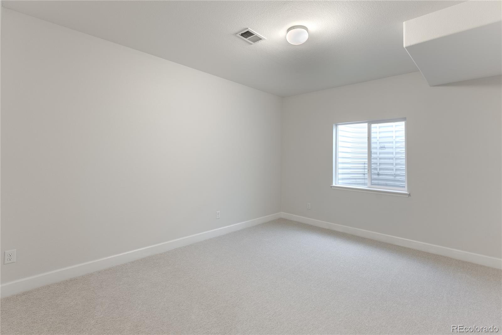 602 Mathews Way Erie, CO 80516 - Photo 36 of 50 an empty room with a window