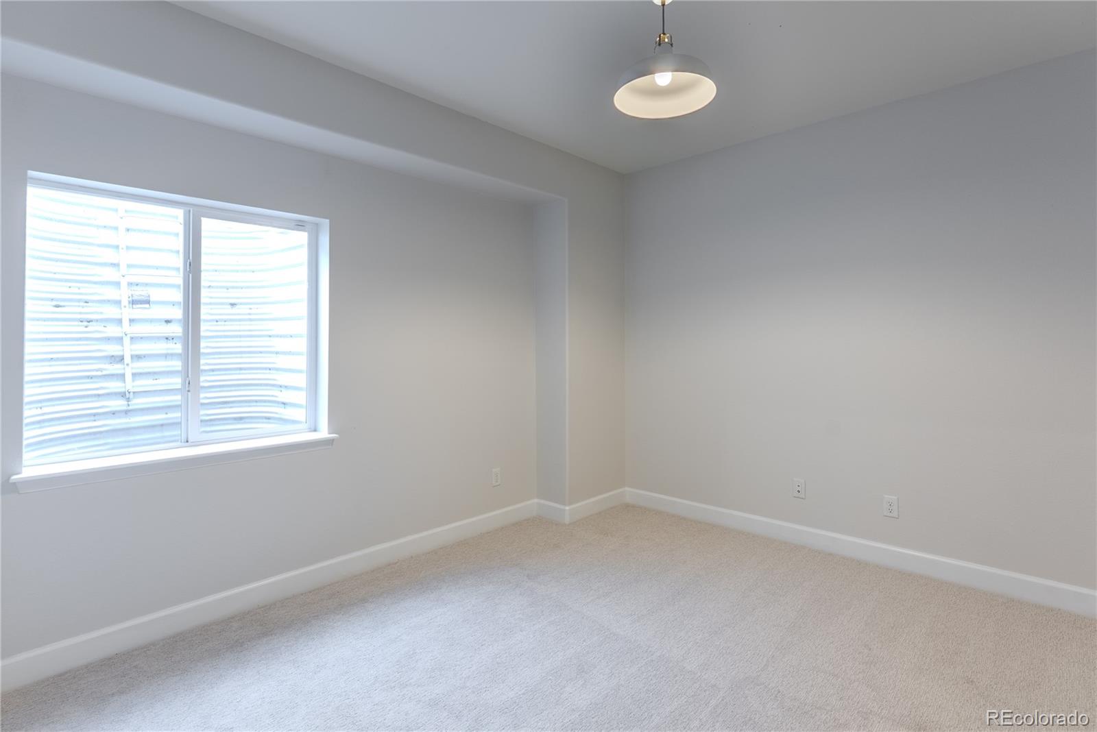 602 Mathews Way Erie, CO 80516 - Photo 37 of 50 an empty room with a window