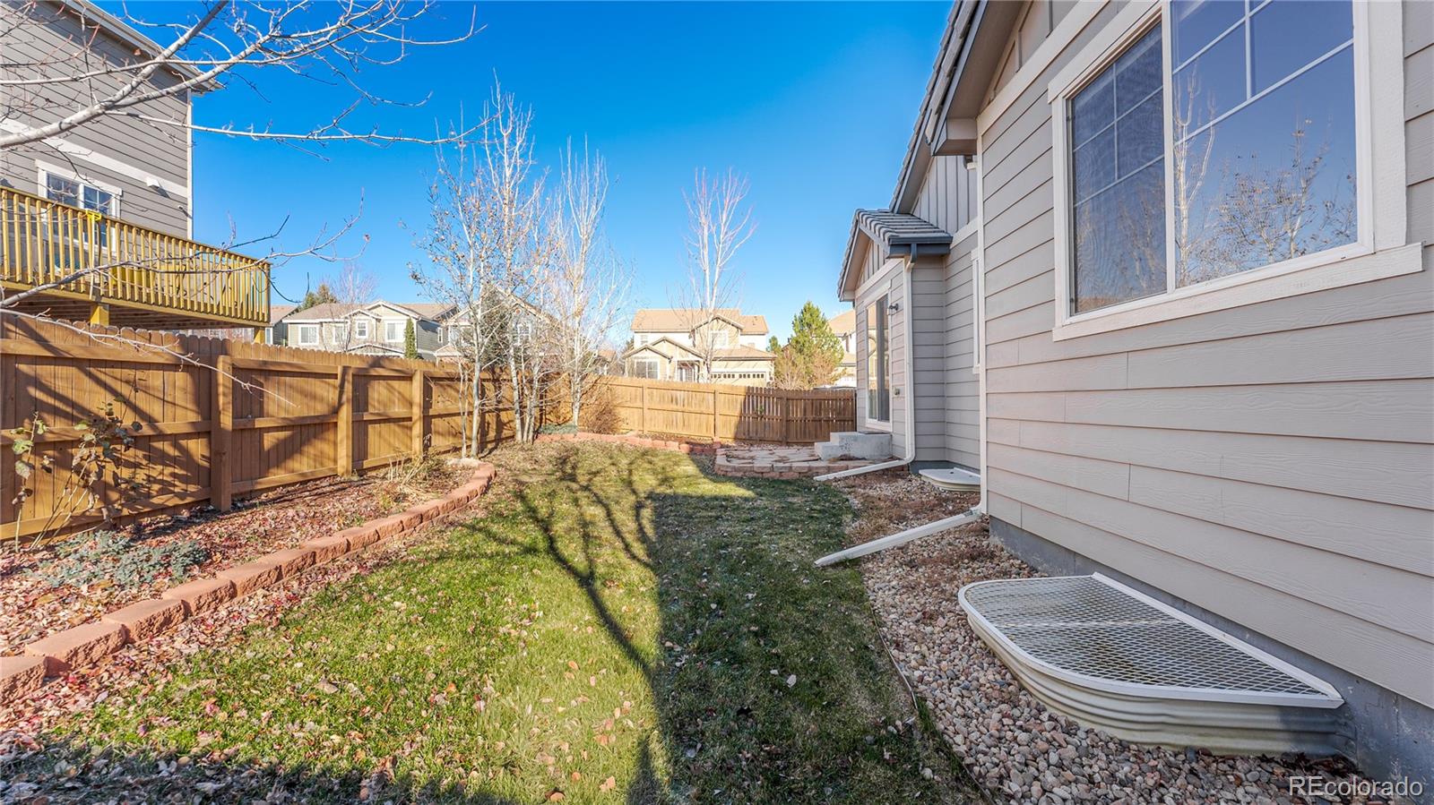 602 Mathews Way Erie, CO 80516 - Photo 39 of 50 a view of a backyard with sitting area